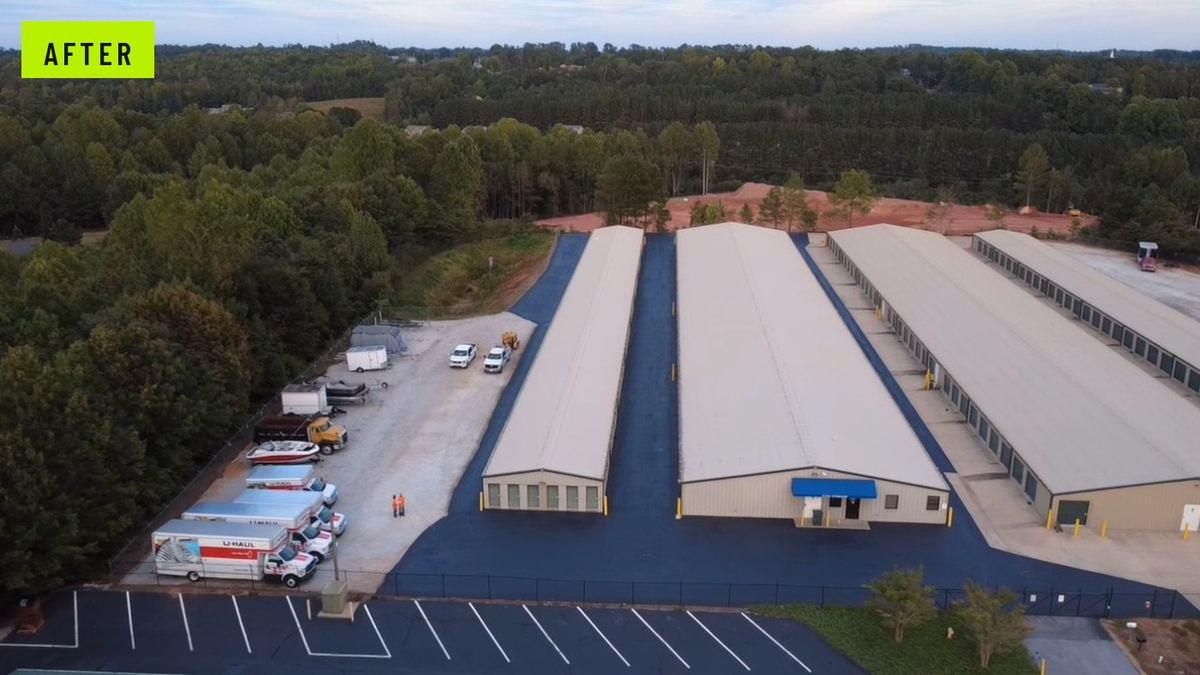 After: the same facility with new black asphalt drive lanes running between every building.